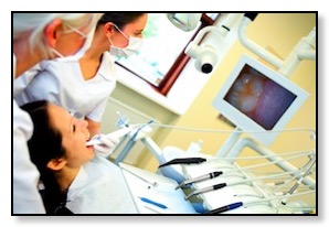 oral surgeon placing dental implant