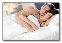 Couple sleeping peacfully with sleep apnea oral appliance